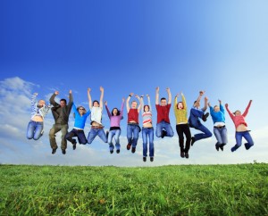 Big group of young jumping people.